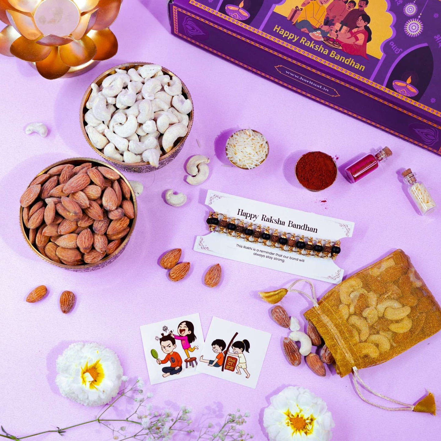 Raksha Bandhan gift set with Rudraksha Karungali bracelet Rakhi, dry fruits, and festive elements.