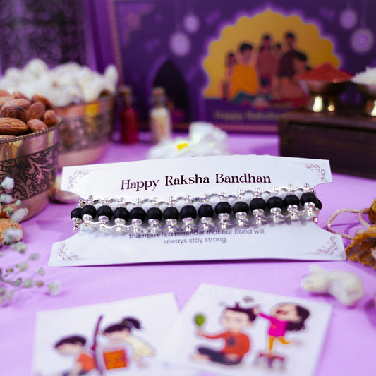 Karungali bracelet Rakhi for Raksha Bandhan spiritual gift with memory stickers and festive decor.