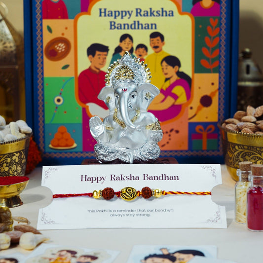 Rudraksha Rakhi with silver gold Ganesha idol for Raksha Bandhan spiritual gift hamper.