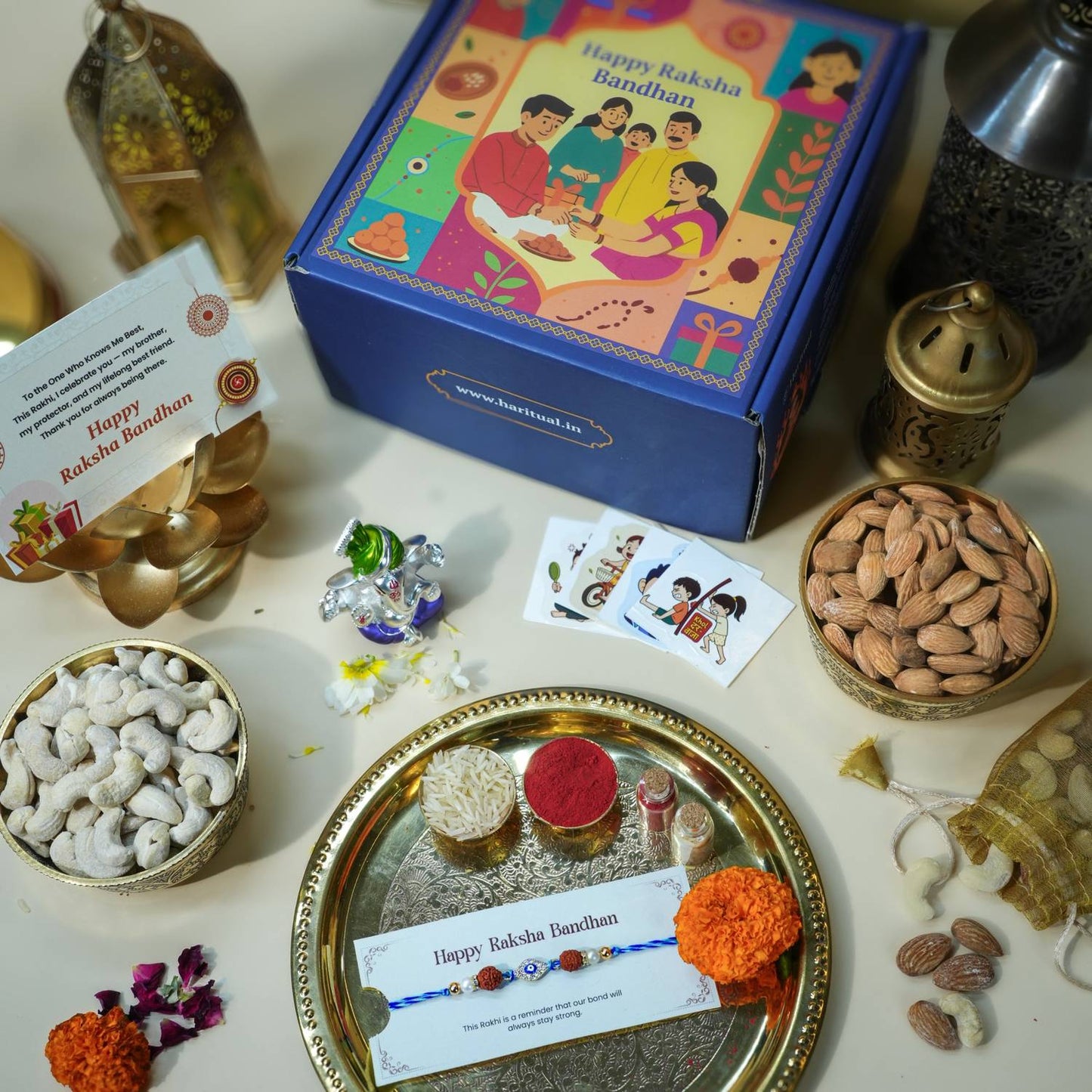 Raksha Bandhan gift hamper with Pagdi Ganesha, Evil Eye Rakhi, dry fruits, and pooja items.