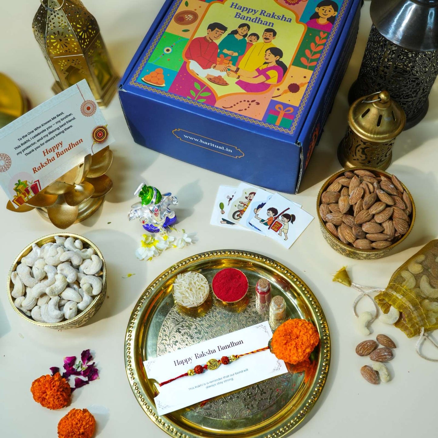 Raksha Bandhan gift set with Pagdi Ganesha idol, Rudraksha Rakhi, dry fruits, and pooja thali.