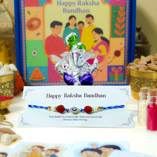 Rudraksha Evil Eye Rakhi with Pagdi Ganesha idol for Raksha Bandhan gift hamper.